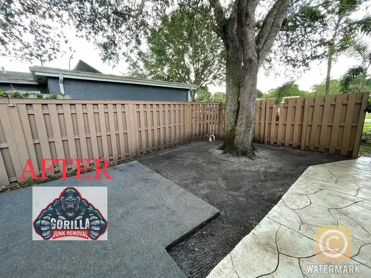 Clean, tidy backyard space after removing all branches and yard waste, ready for landscaping or outdoor activities