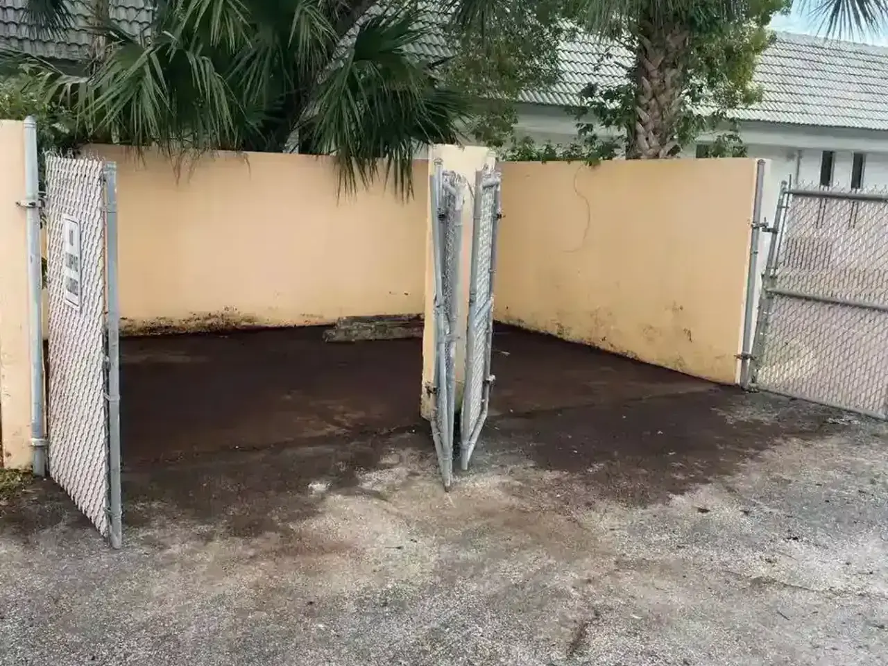 Clean, empty fenced yard area after junk removal service cleared all trash and debris for a fresh, usable space